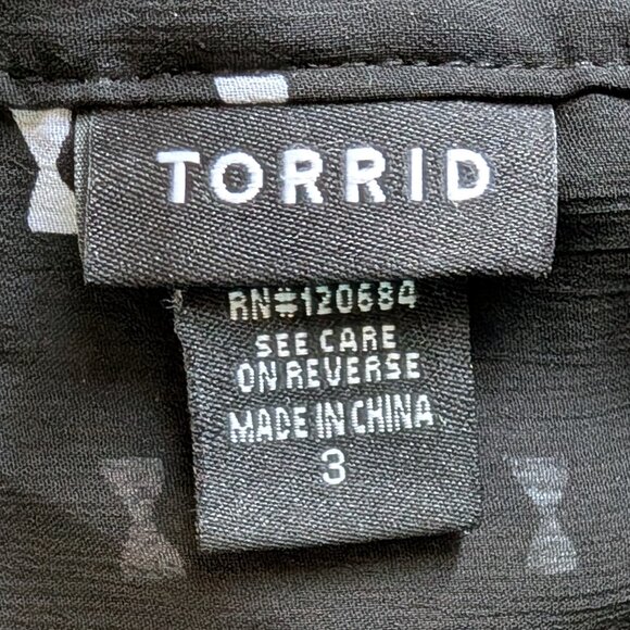 Torrid Bow Print Ruffle Front Blouse in Black & White - Picture 2 of 11